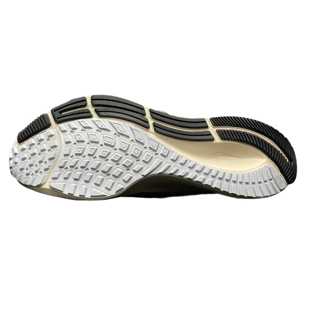 Close-up of a shoe sole with tread pattern on a metallic surface