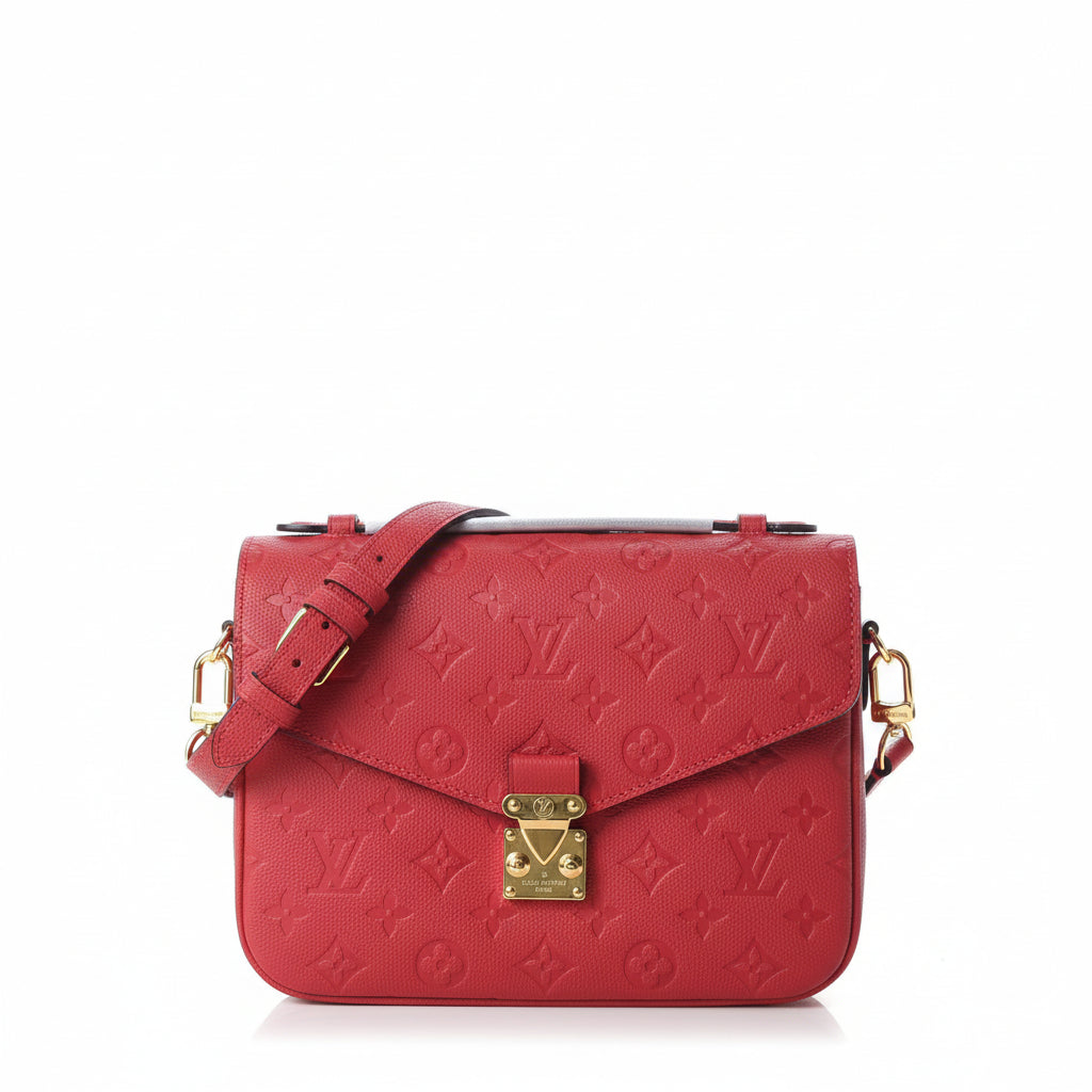 Red handbag with gold accents on a white background