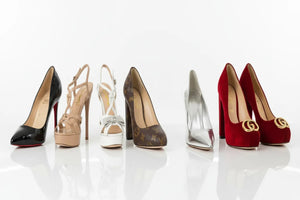 Collection of high-heeled shoes in various colors and designs on a white background at SnickBasement