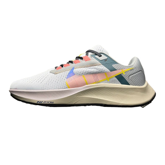 Multicolored running shoe on a textured surface